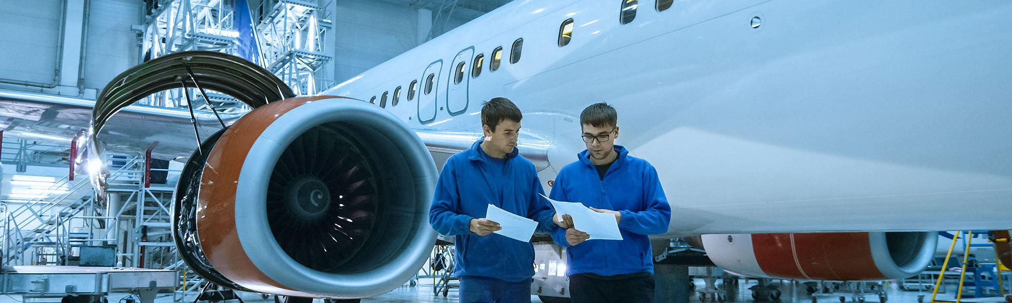 Aircraft maintenance mechanic uses tablet
