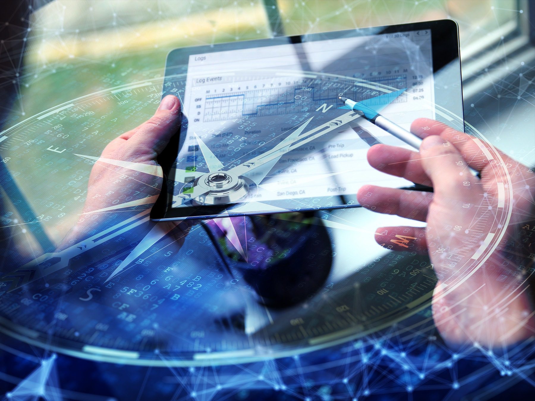 man using stylus on digital tablet