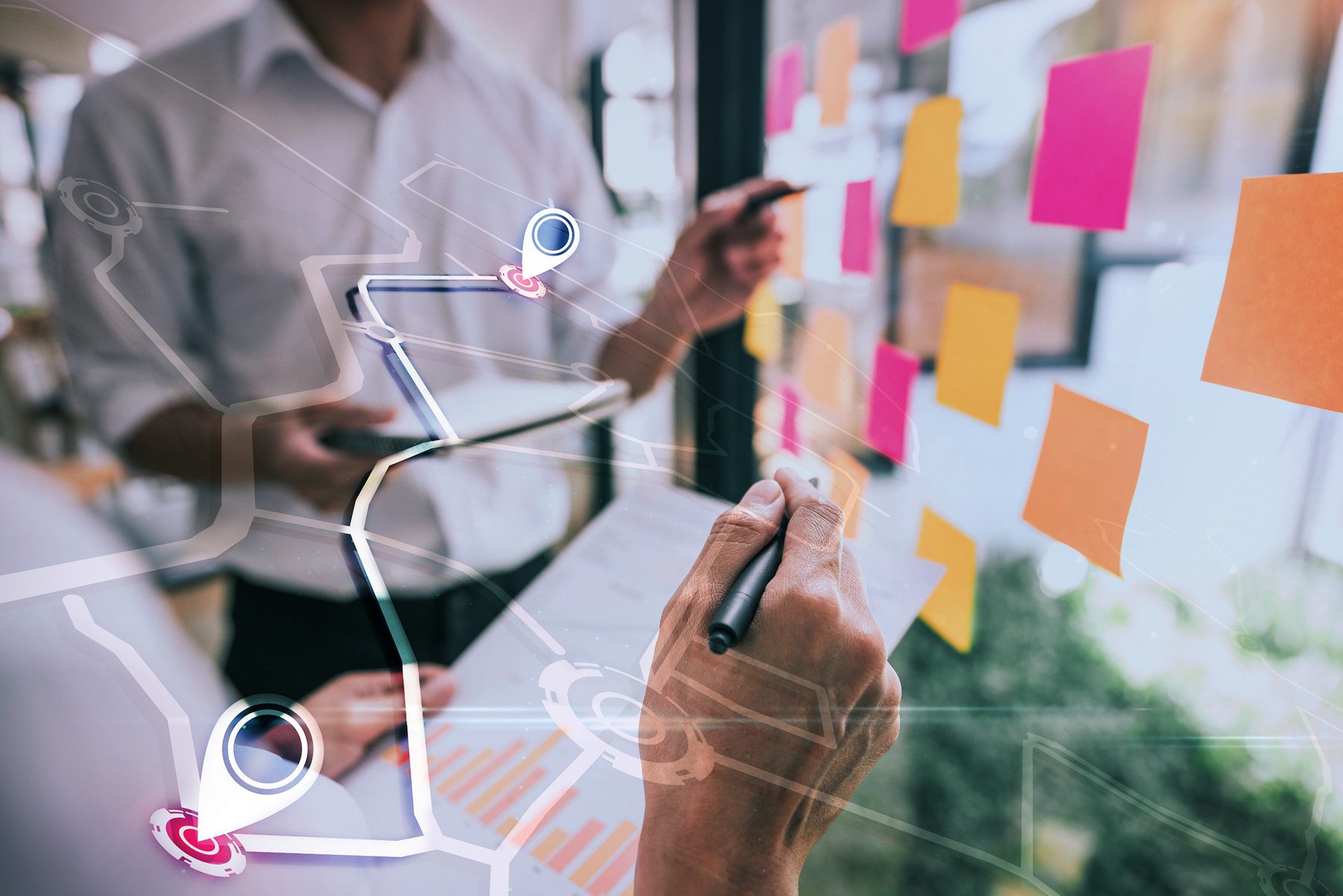 Business people meeting at office and use sticky notes on glass