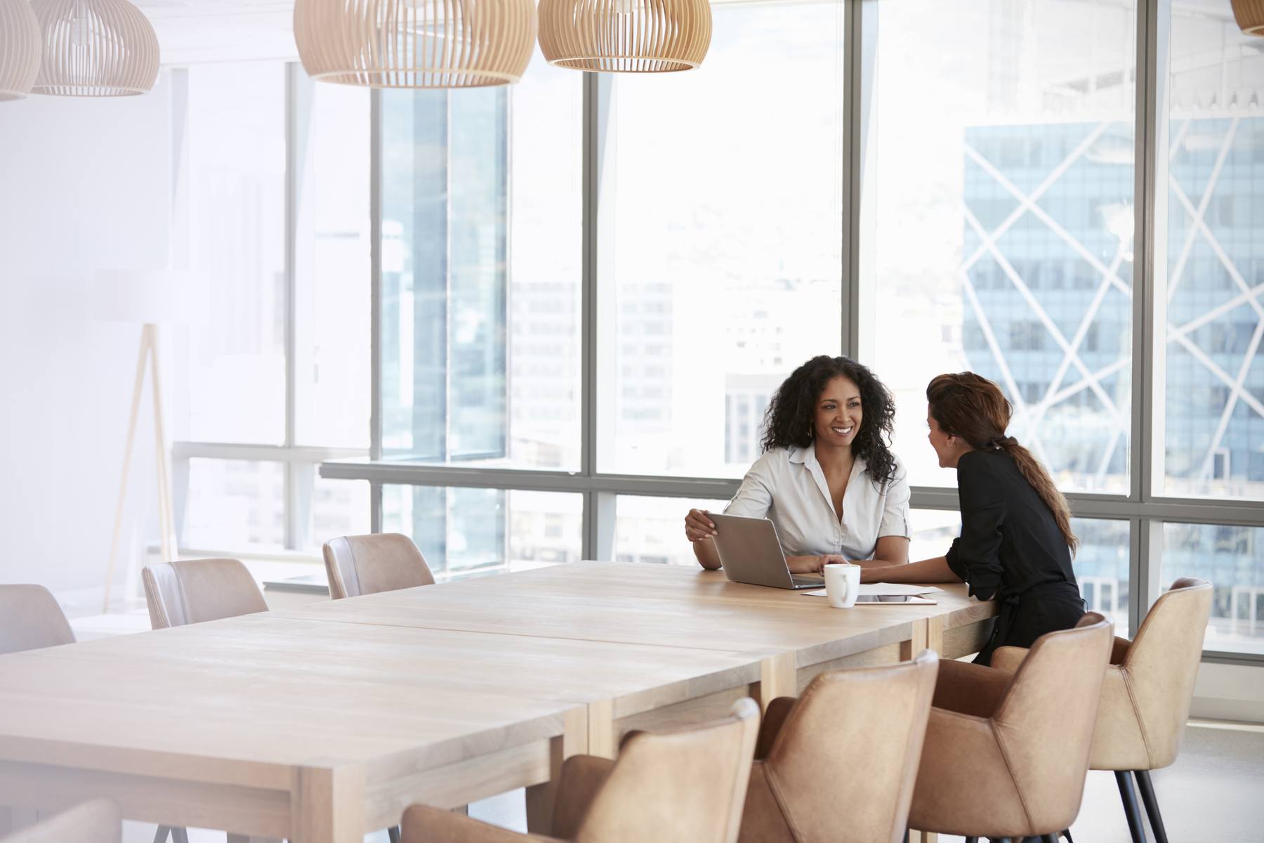 business women having a one on one in conference room