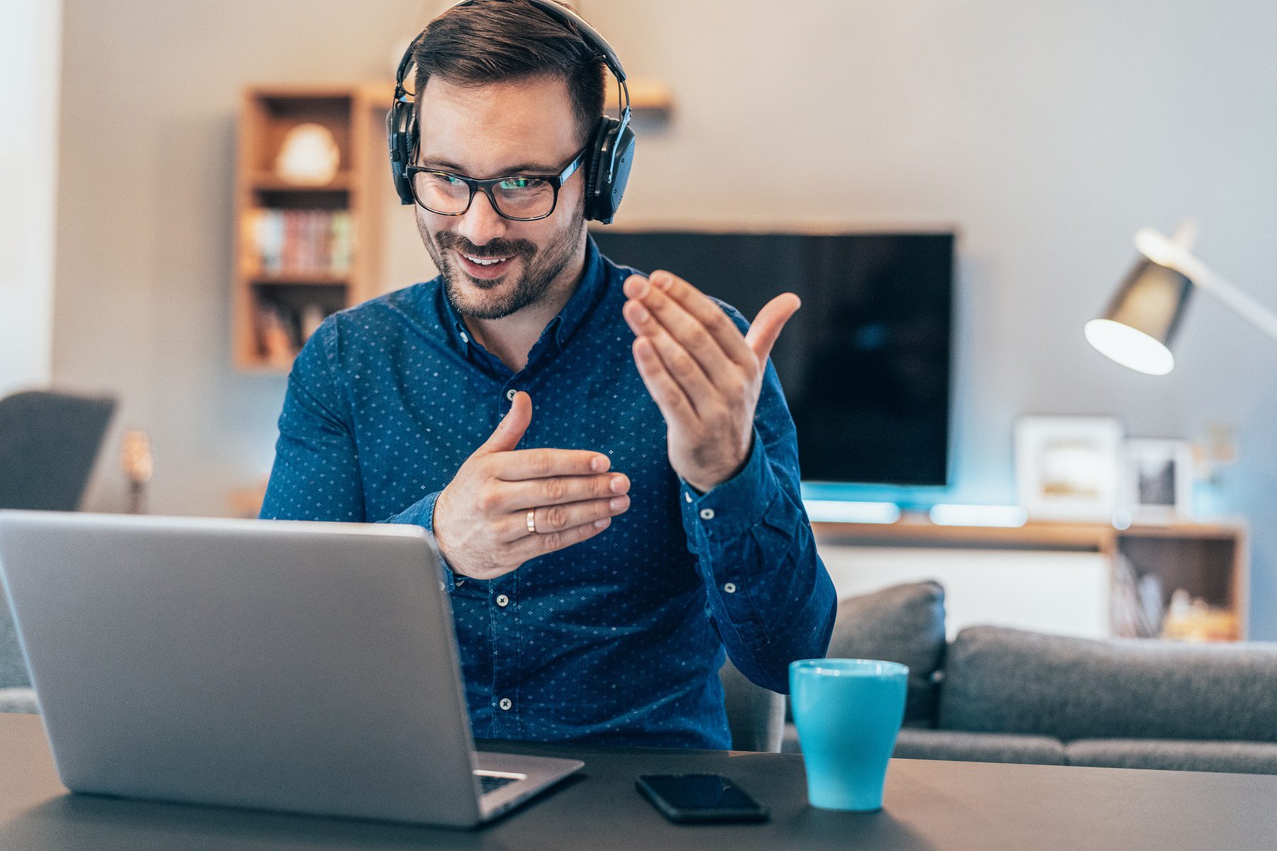 businessman with headset talking on video conference call