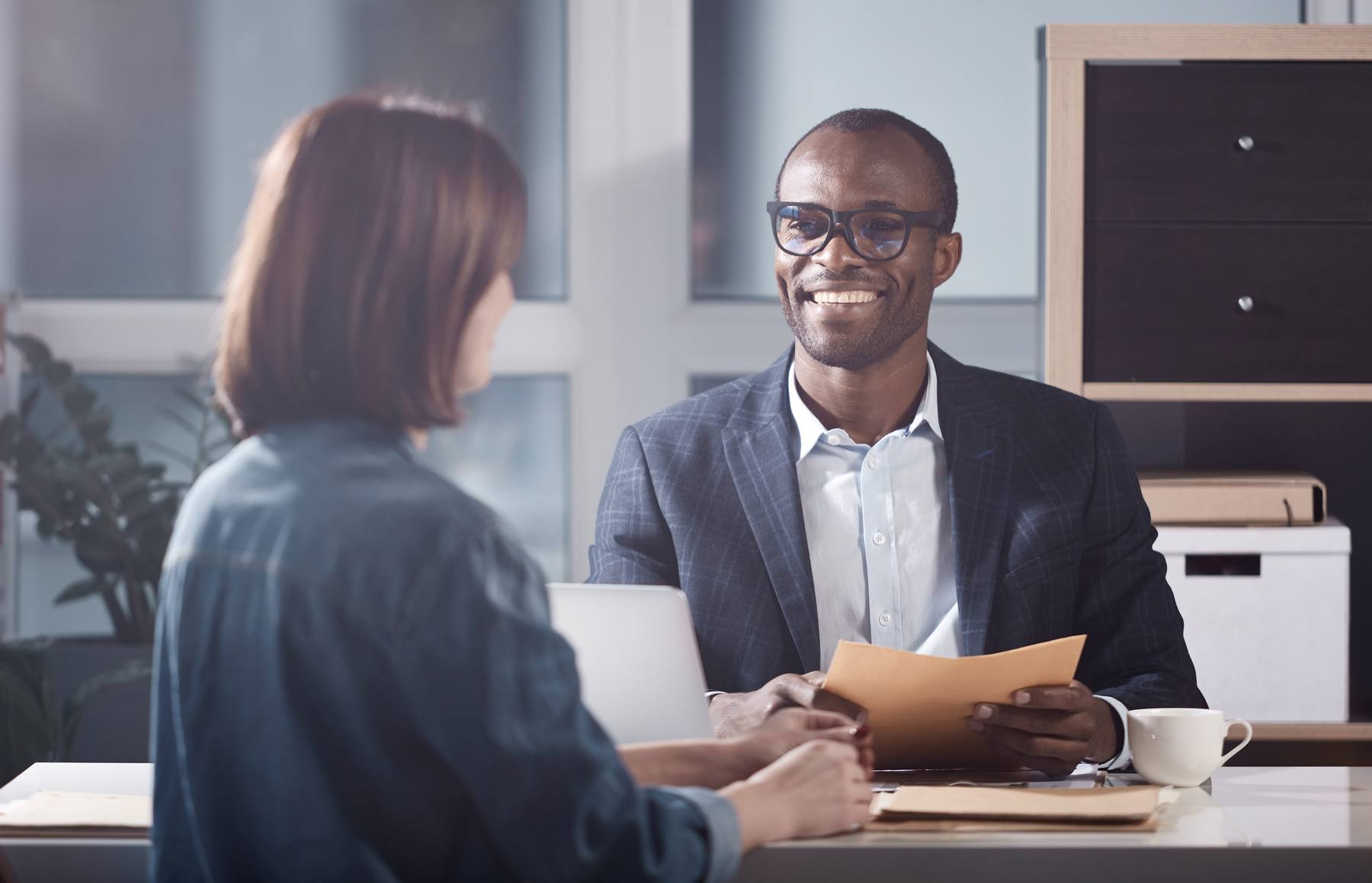 businessman interviewing businesswoman