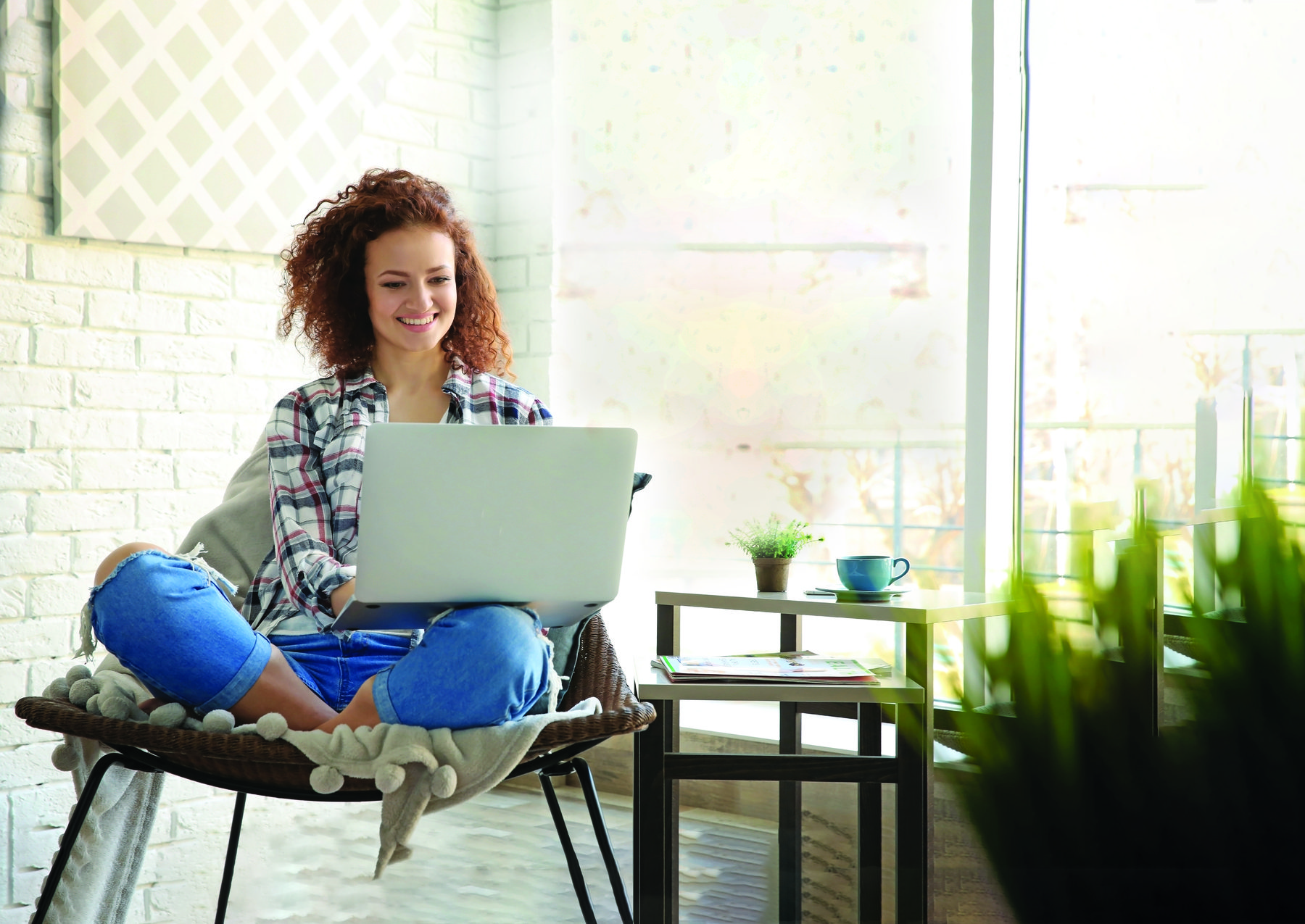 smiling woman on her laptop