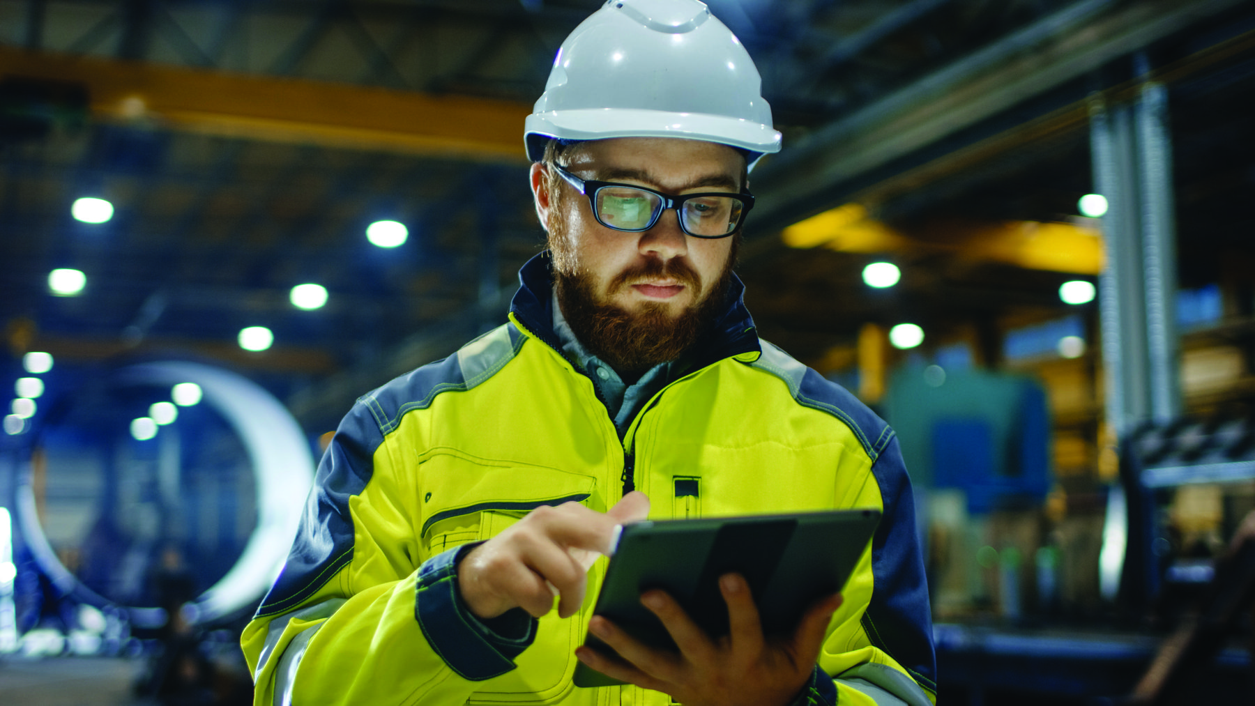 Industrial Engineer in Hard Hat Wearing Safety Jacket