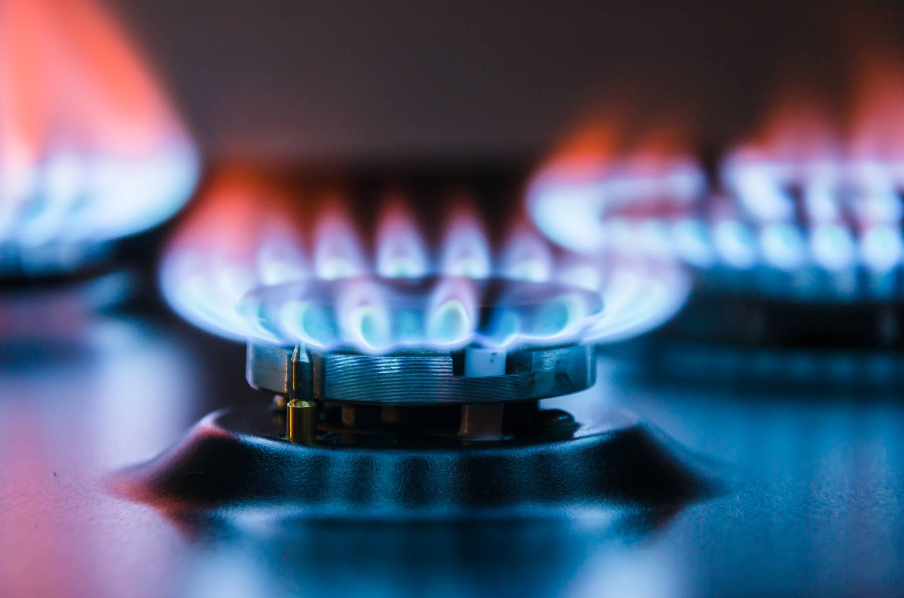 Burning gas burner with Blue fire with a red flame.