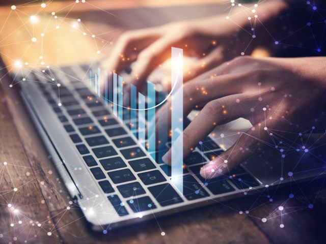 hands typing on keyboard