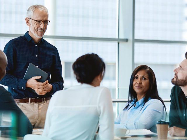 businessmen and woman in a business meeting