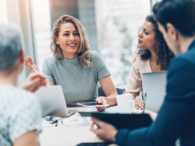 businesswoman smiling during meeting