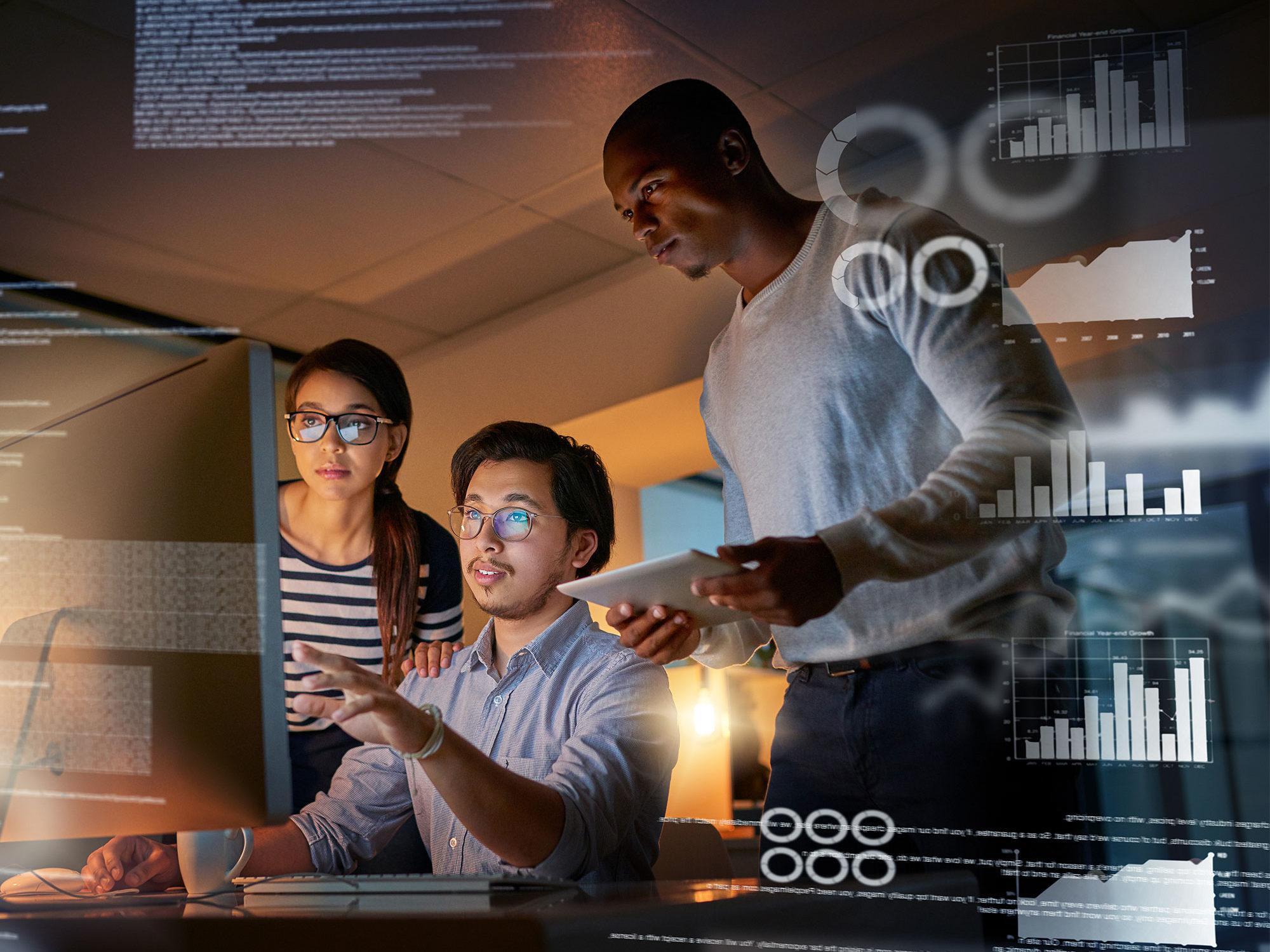 Computer programmers looking through data in the office