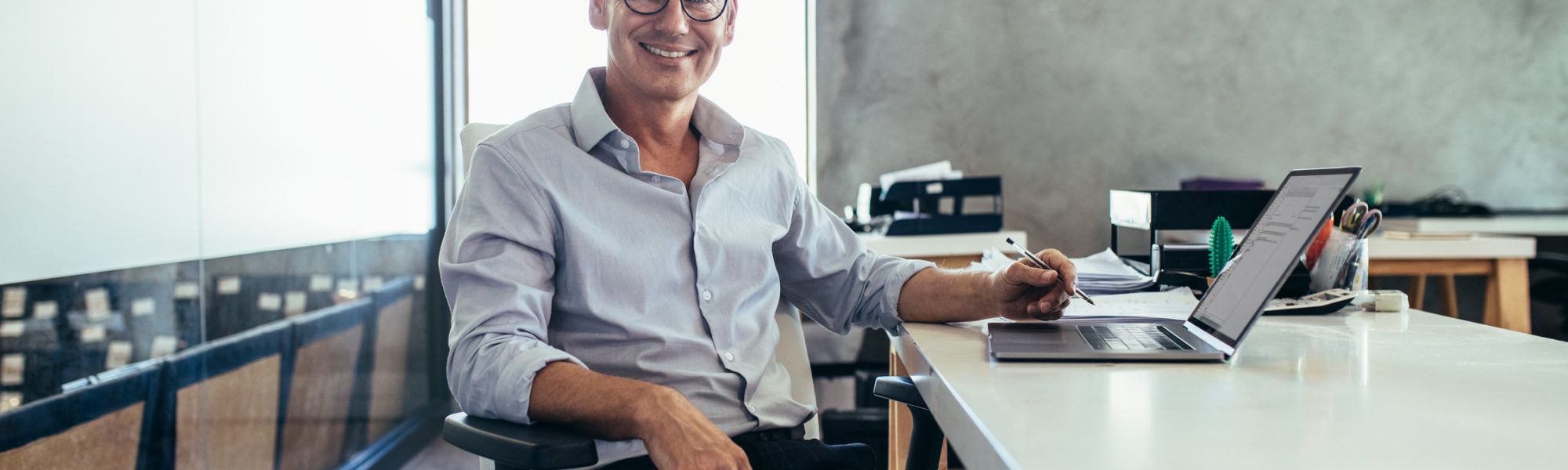 businessman with glasses smiling
