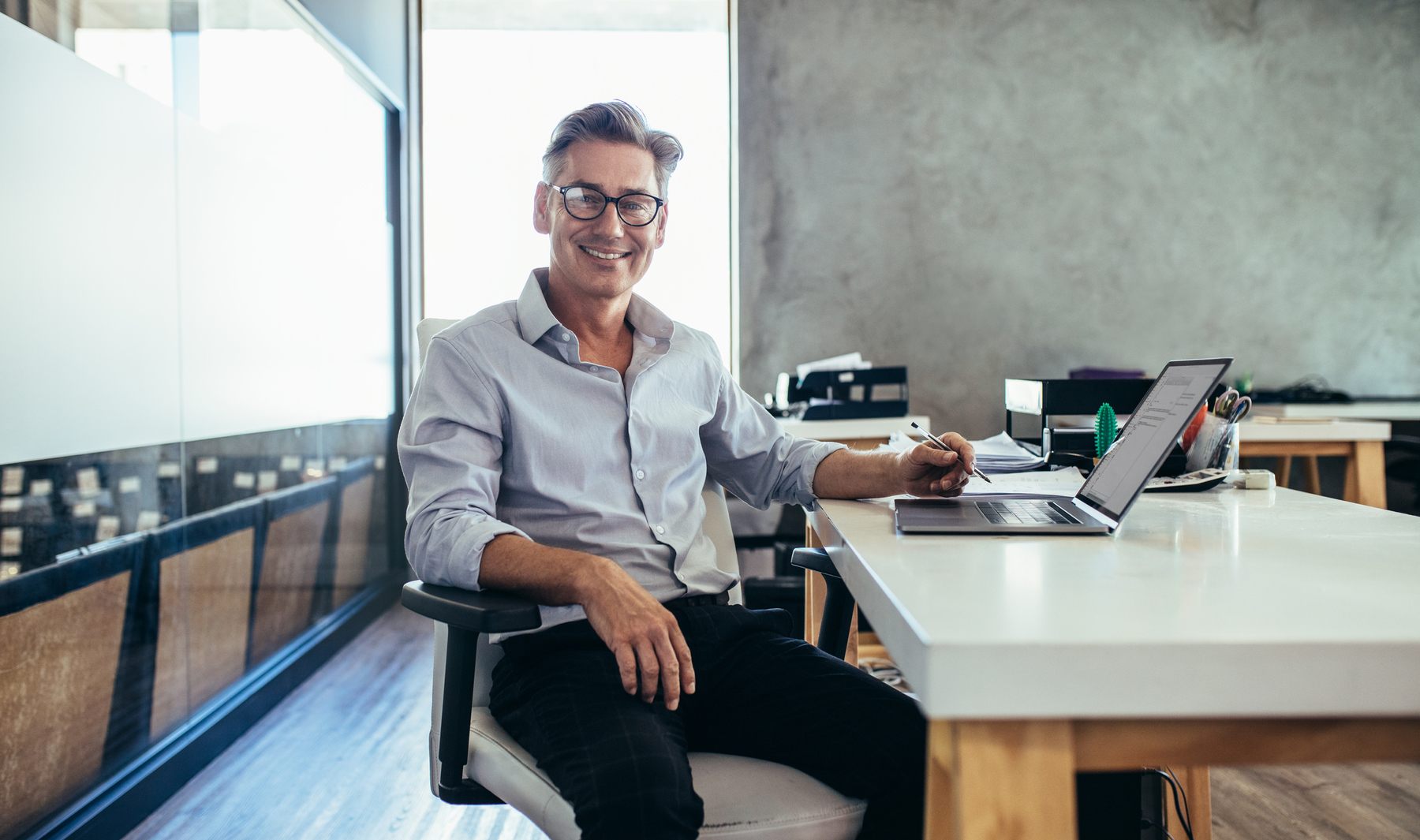 businessman with glasses smiling