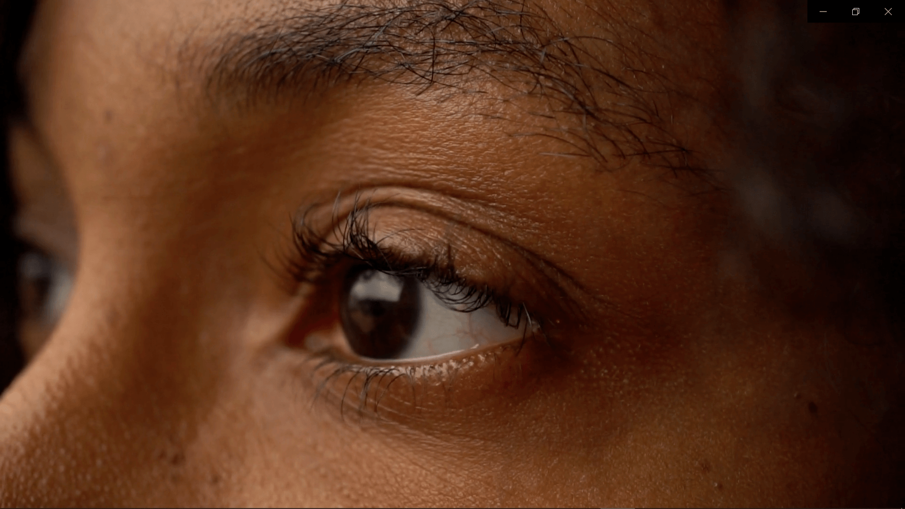 close up view of womans eye and eyebrow area