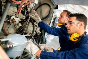 Mechanics fixing a helicopter