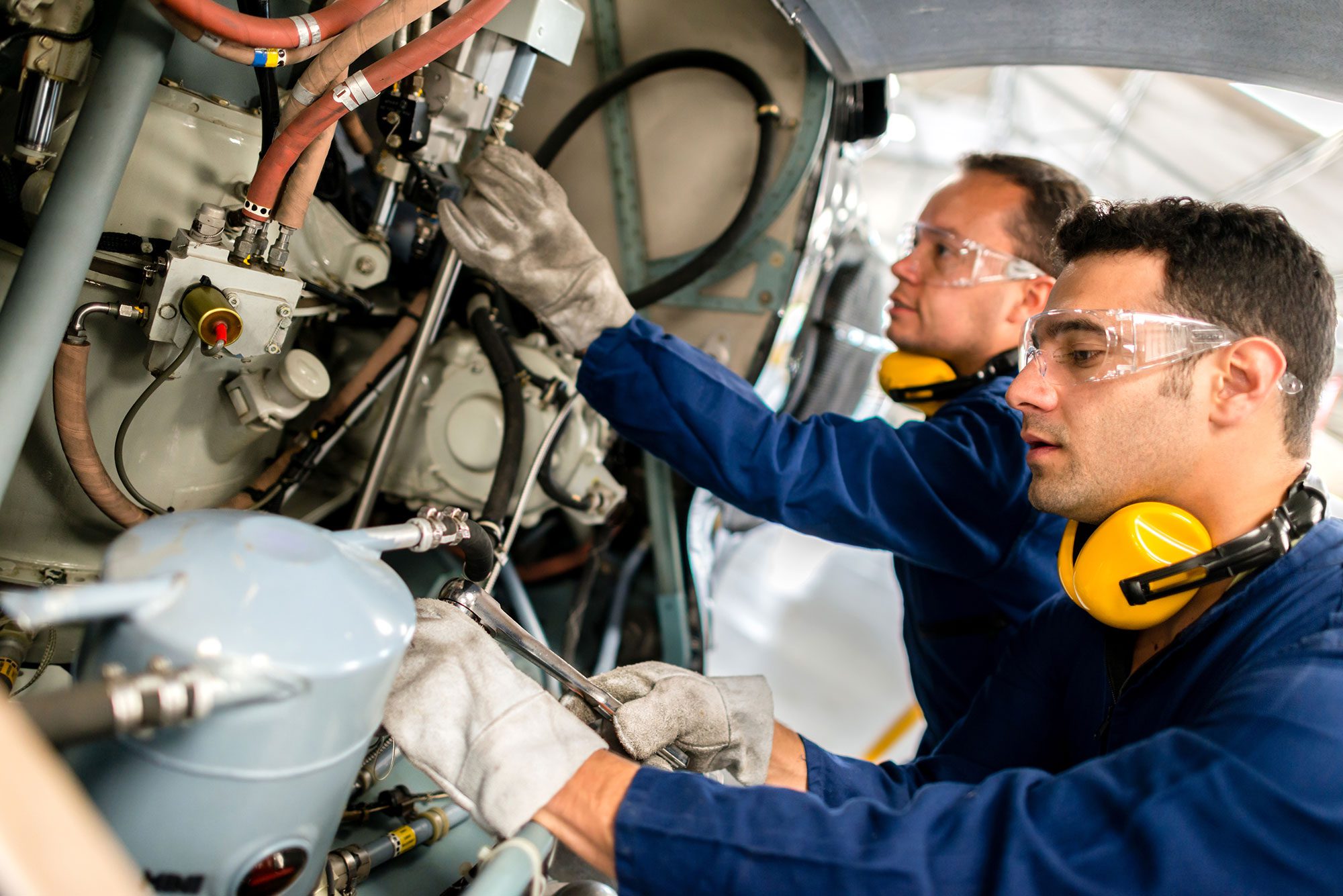 Mechanics fixing a helicopter