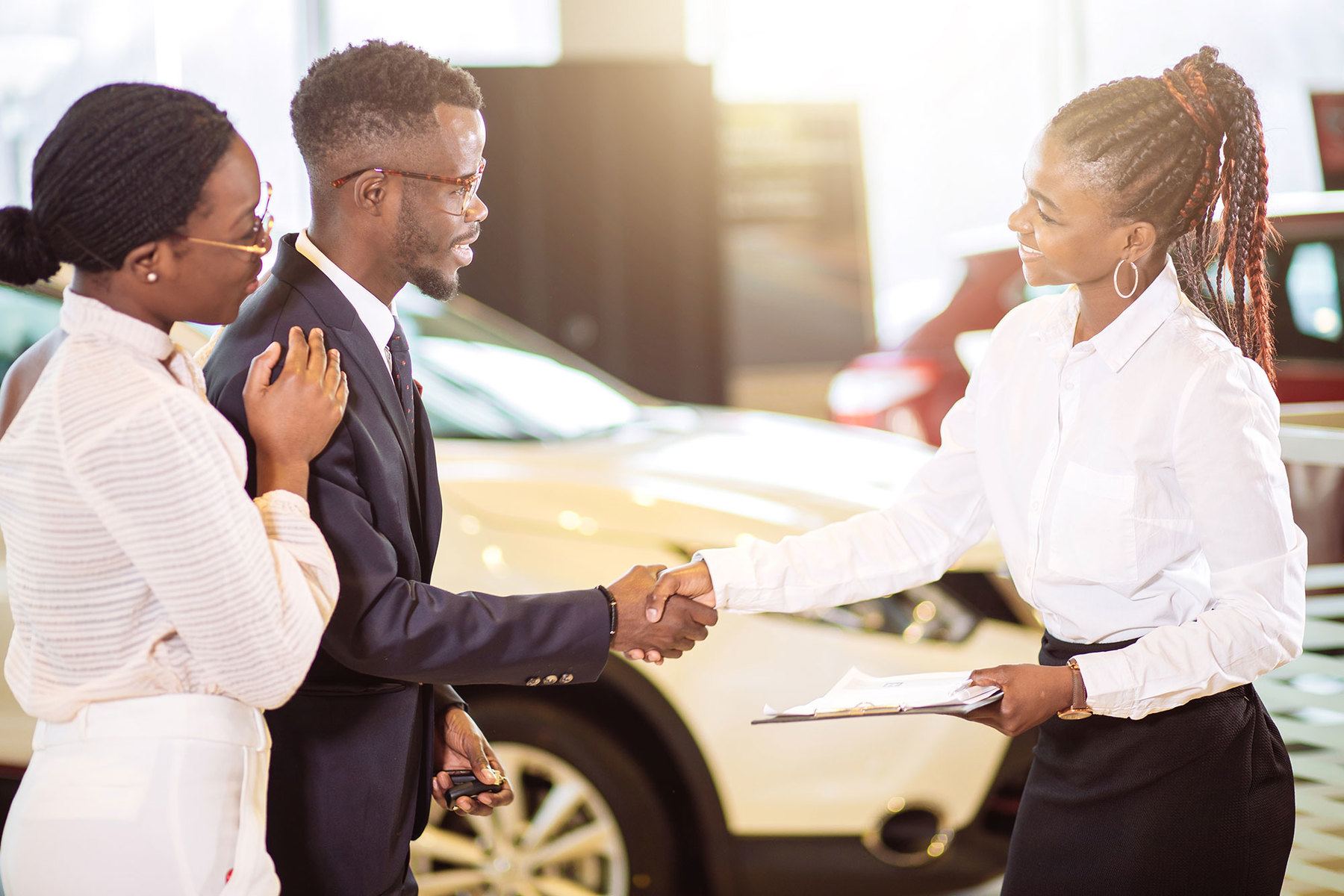 african american couple purchasing vehicle