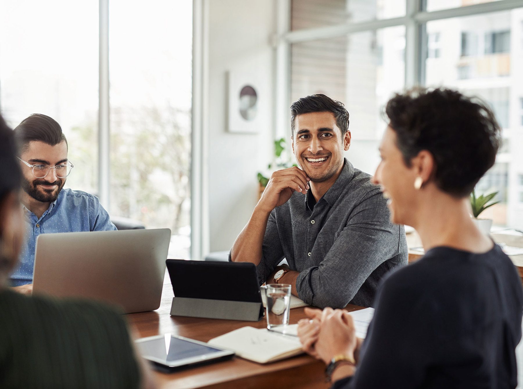 employees laughing in a meeting