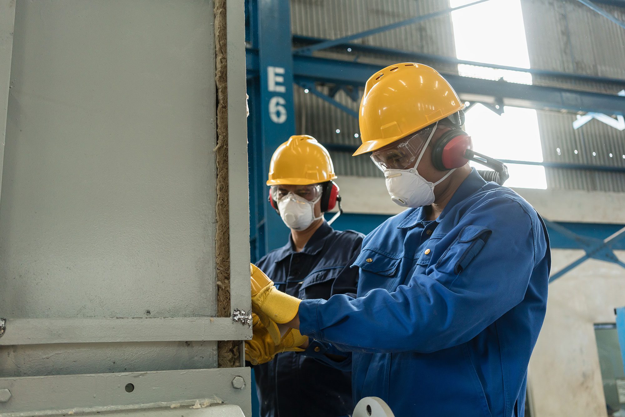 energy blue collar workers wearing safety equipement