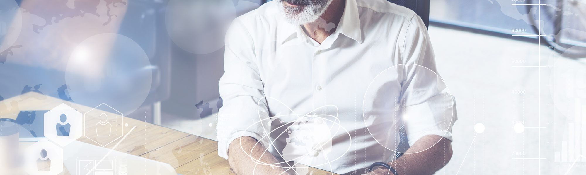 Concept of digital screen with global virtual icon,diagram, graph interfaces.Adult successful businessman wearing a classic glasses and working at the wood table in modern coworking office.Horizontal.