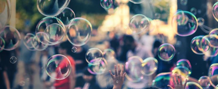 Young man blowing soap bubbles in the concrt - the biggest open air ticket free rock music festival in Europe