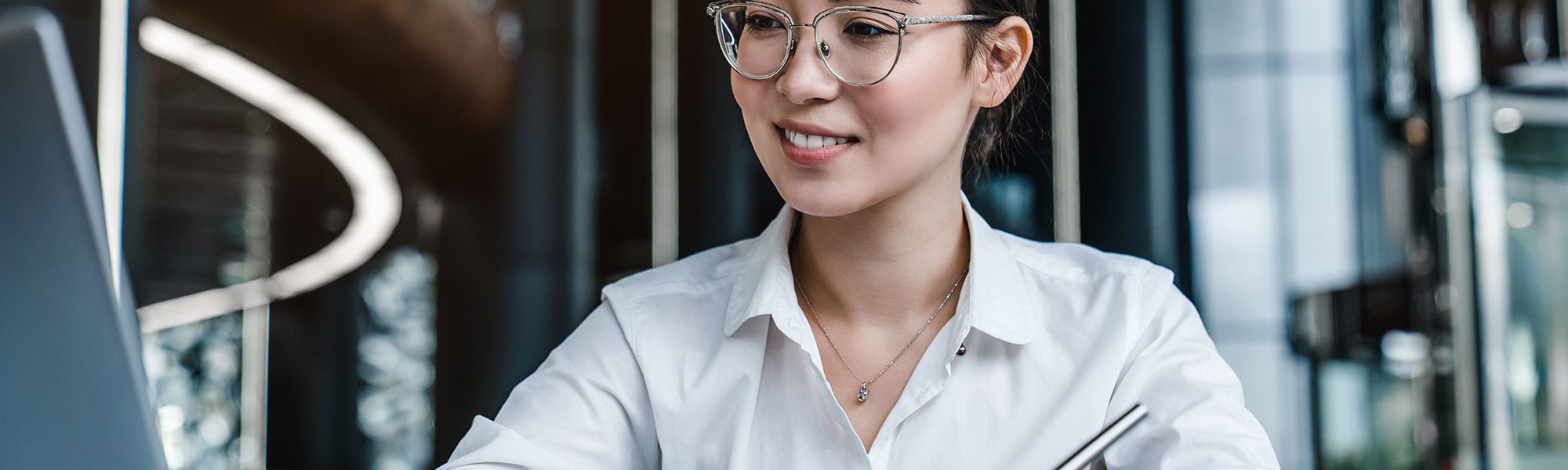 Chinese female working on laptop