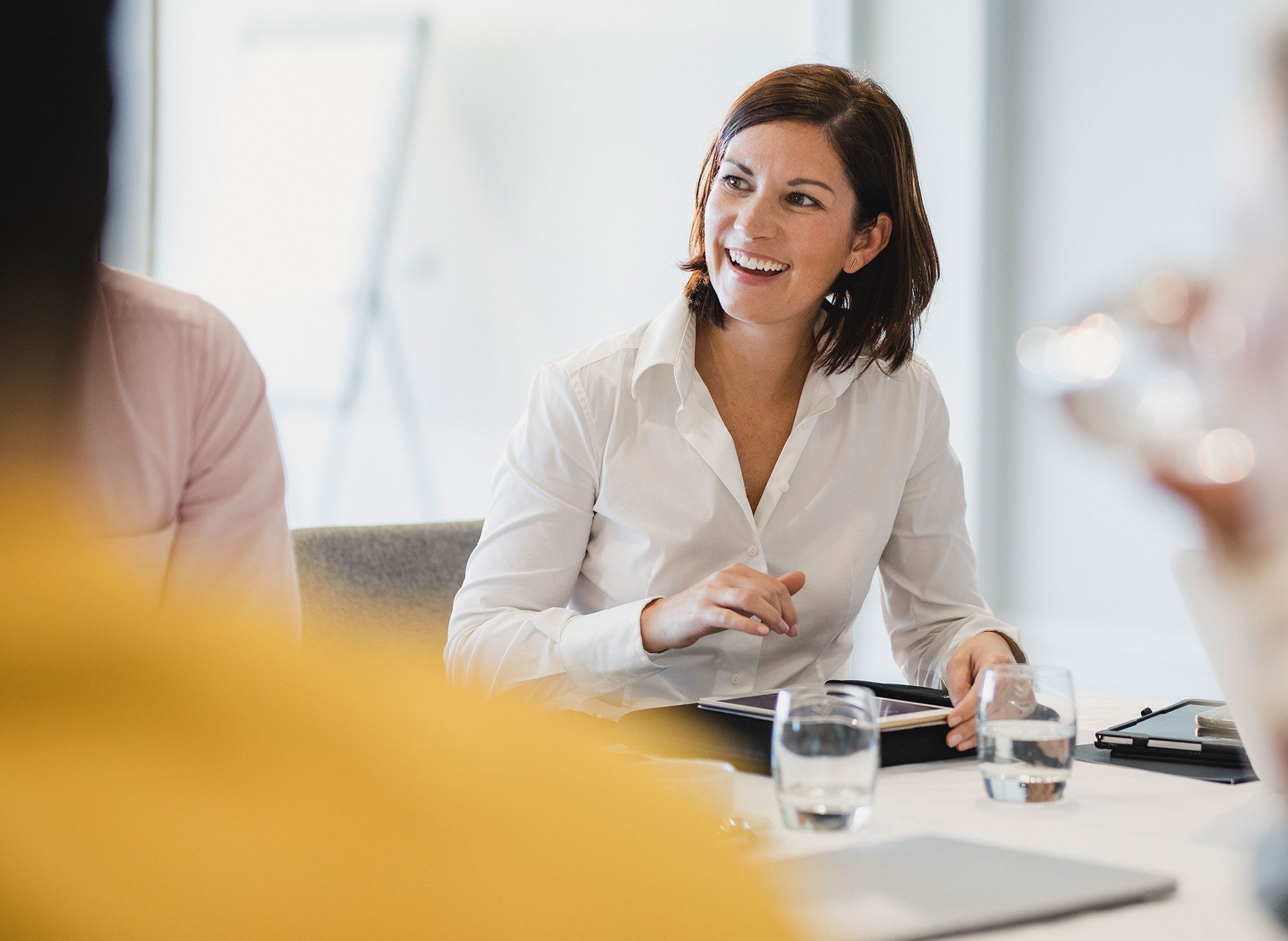 Happy female businesswoman in a meeting
