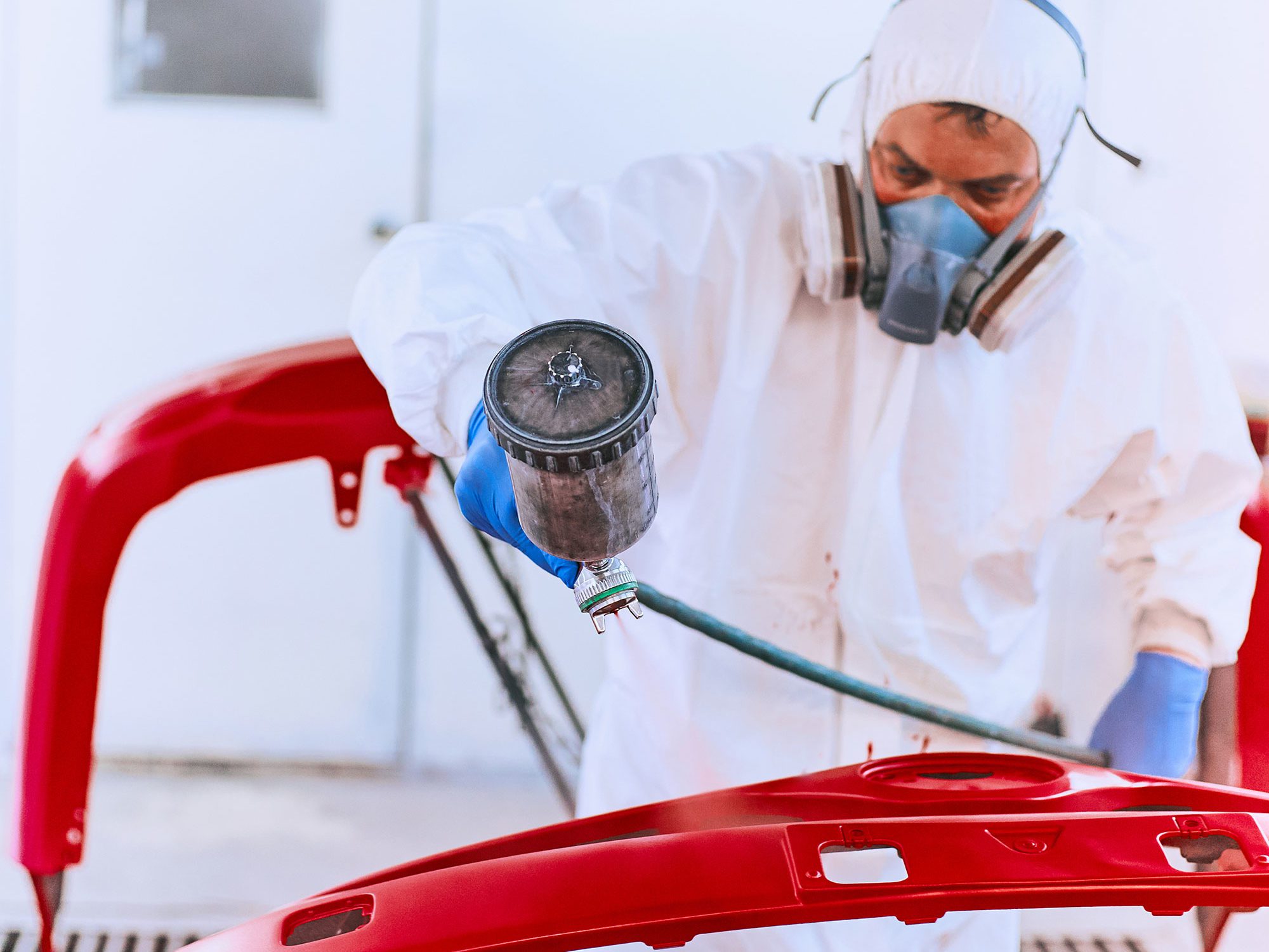 painting car at a mechanic shop